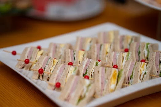 corporate catering spread with sandwiches and salads